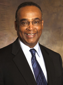 Norman Rice profile headshot